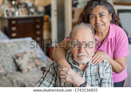 Senior Man with their Caregiver at Home. Concept of Health Care for Elderly Old People, Disabled Royalty-Free Stock Photo #1743136835