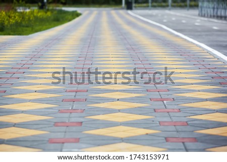 Sidewalk with from colored tiles