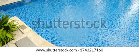Panoramic photo of the pool with blue water