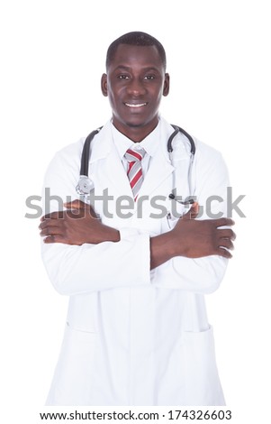 Portrait Of A Young African Male Doctor Over White Background