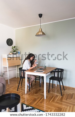 Excited woman holding a credit card and shopping online stock photo