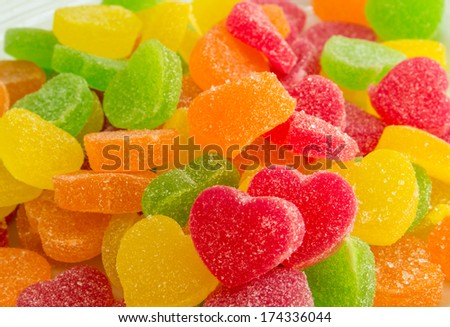 Colorful fruit candy in sugar in the form of hearts