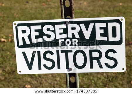 Reserved for visitors - sign seen by the landmark