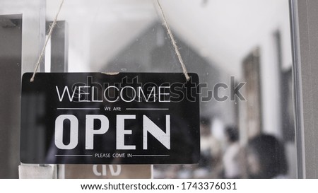 Storefront sign, welcome to open
