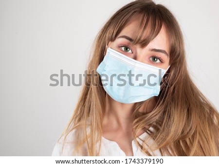 pandemic coronavirus. antiviral medical mask for protection against diseases, woman with sincere gaze