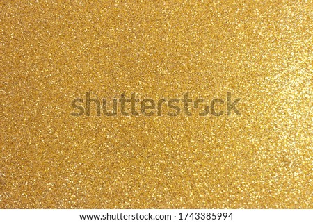 Golden glitter texture background. Shiny festive backdrop. 