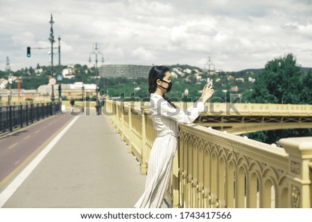 Asian girl is walking on the bridge