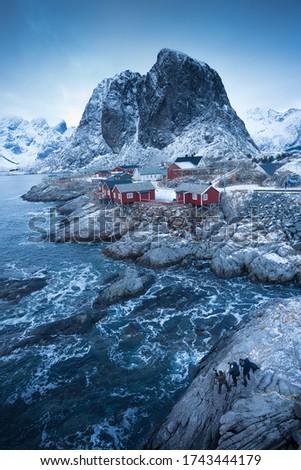 Famous tourist attraction Hamnoy fishing village on Lofoten Islands, Norway with red rorbu houses in winter / landscape photo