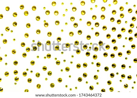 yellow rhinestones on a white background, top photo. design for text