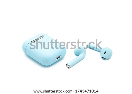 Wireless bluetooth earphone or earbud or headphone, isolated on white background Royalty-Free Stock Photo #1743471014