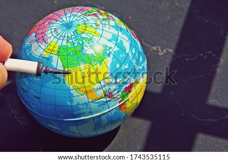 Picture showing the World globe indicating the United States 