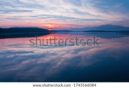 Beautiful Nature Background.Amazing Colorful Clouds.Water Reflections.Magic Artistic Wallpaper.Creative Photography.Blue Sky and
Sunset.Mountain Landscape.Tranquil Panorama.Sun and Lake.Blue Color.