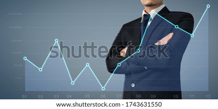 Businessman plan graph growth and increase of chart positive indicators in his business