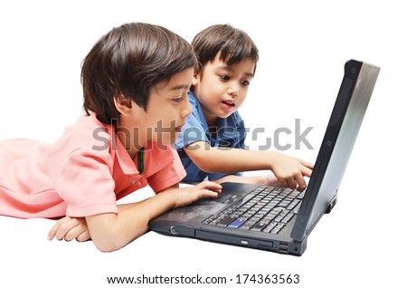 Little sibling boys use laptop for education on white background