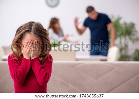 Young couple and their daughter in family conflict concept Royalty-Free Stock Photo #1743655637