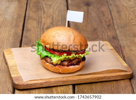 Beef burger on wooden background