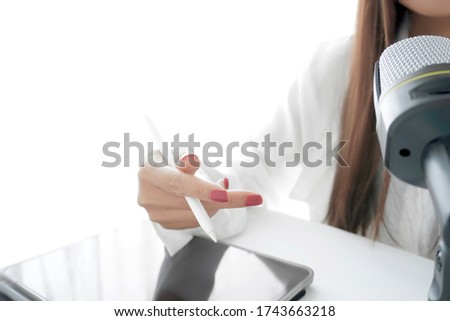 A woman hand explaining while doing in Podcast recording concept.