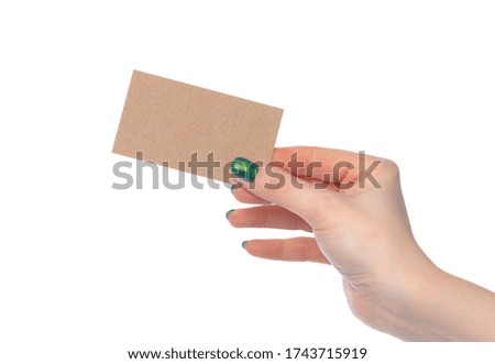 Craft paper card in female hand isolated on white