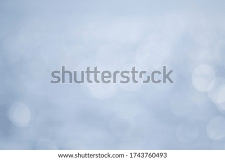 Bokeh on a background of blue water. Bokeh light effect. Soft focus on rippled background.