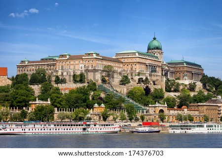 Buda Castle (Royal Palace) and passenger boats on the Danube River in Budapest, Hungary. Royalty-Free Stock Photo #174376703