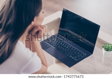 Photo of pretty interested student lady laptop notebook online watch corporate webinar working house university college lecture quarantine time stay home living room indoors