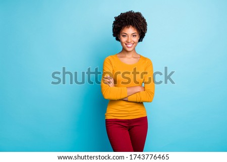 Portrait of cheerful content professional worker afro american girl cross hands ready decide work decisions wear modern red pullover isolated over blue color background