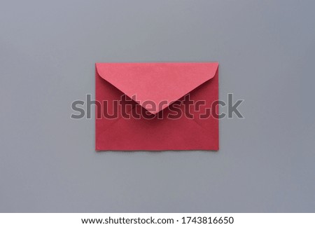 Red letter on grey background