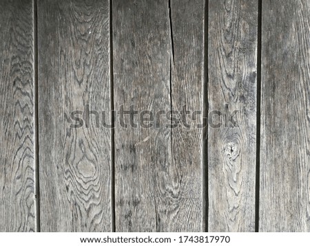 Wooden floor, wall. Old boards with knots and cracks. Unpainted, unvarnished wood. Vertical natural old straps for background.