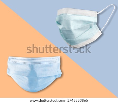 Medical mask or surgical earloop mask on the colored background Royalty-Free Stock Photo #1743853865