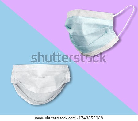 Medical mask or surgical earloop mask on the colored background