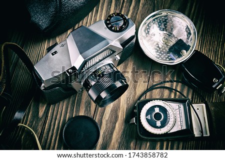 Old vintage photo camera, flash and exposure meter