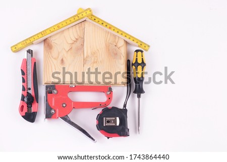 Set of construction tools for homeuse repair isolated.Flat lay different red and yellow building tools on white background.Home repair, father's day, stay home, DIY concept.Top view with copy space Royalty-Free Stock Photo #1743864440