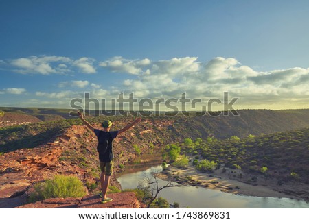 Man in the Viewpoint overlooking in Kalbarri NP, Western Australia                                Royalty-Free Stock Photo #1743869831