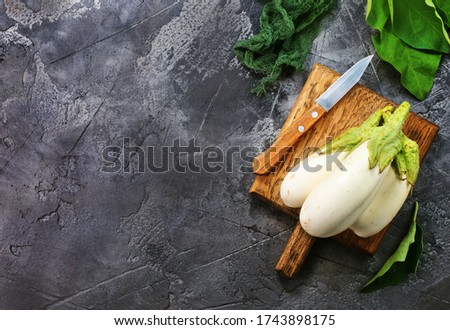 raw eggplant on a table, stock photo