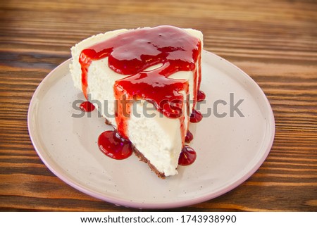 delicious cheesecake with strawberries on a plate Royalty-Free Stock Photo #1743938990