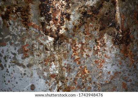 The surface of metal plates with rust stains are used for the background