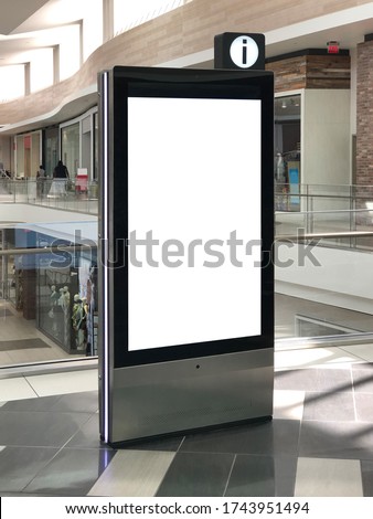 Mockup standalone big screen info kiosk. Digital media with blank white screen modern panel, display, signboard for advertisement design in a shopping center and mall. Including clipping path. Royalty-Free Stock Photo #1743951494