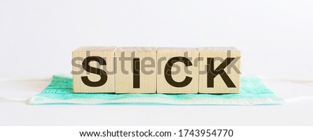 SICK medicine words on the wooden block.Healthcare conceptual for hospital, clinic and medical busines
