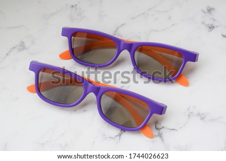 Plastic 3D glasses are on the table