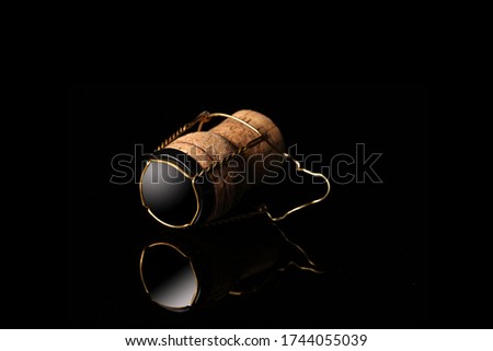 champagne cork isolated on black background with copy space for your text