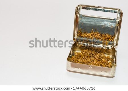 Automatic Metal Cigarette Rolling Machine for tobacco. isolated on white background.