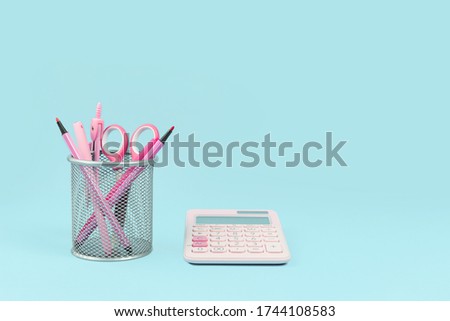 Women in business. growth development and success concept banner. Pink office supply items on desk, blue background. Innovative thinking startup or STEM. Copy space