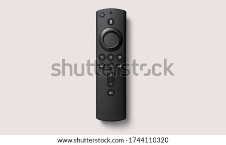 Black smart remote control on a white background