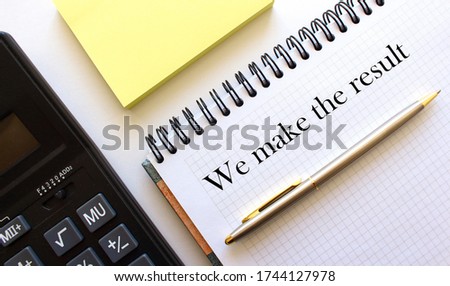 notebook with the inscription, calculator, pen lying on a white table