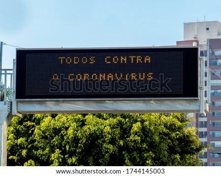 luminous sign with warning phrase. Translation: all against the coronavirus.