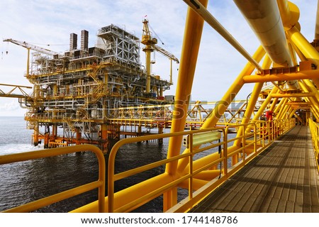 Bridge way at Petroleum oil and gas process offshore field, Drilling, discovery and development of oil and gas resources which lie underwater through drilling a well,construction out at sea