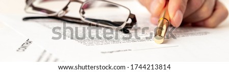 Businessman points on signature line on contract in office. Blurred documents and glasses. selective focus. Contract signing concept. Blurred text. Banner