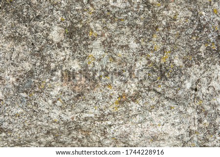 Rock covered with cracks. Natural stone texture.