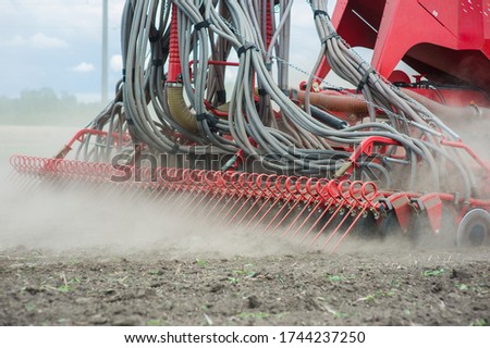 Close up huge agriculture machine at field