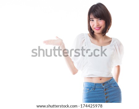 Happy woman showing open hand palm with copy space  on white background.